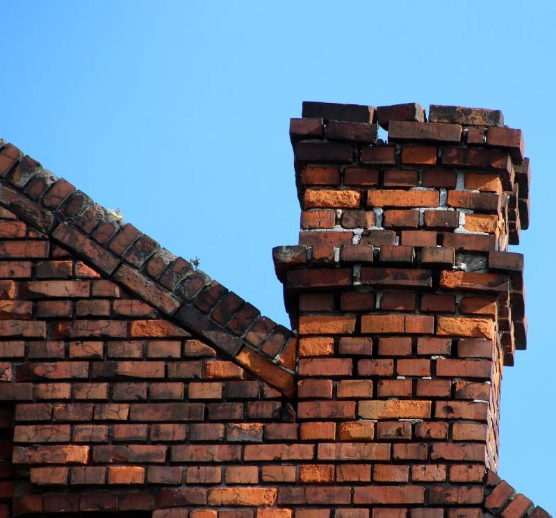 Signs Your Ramona Home Needs a Chimney Inspection Damaged chimney on an Ramona home showing cracks and missing mortar